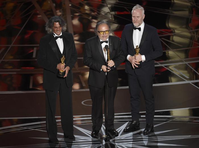 Giorgio Gregorini, from left, Alessandro Bertolazzi, and Christopher Allen Nelson accept the award for best makeup and hairstyling for "Suicide Squad" at the Oscars on Sunday, Feb. 26, 2017, at the Dolby Theatre in Los Angeles. (Photo by Chris Pizzello/Invision/ANSA/AP) [CopyrightNotice: 2017 Invision]