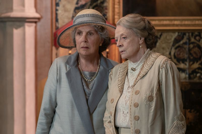 Credit: Ben Blackall / © 2021 Focus Features, LLC Penelope Wilton stars as Isobel Merton and Maggie Smith as Violet Grantham in DOWNTON ABBEY: A New Era, a Focus Features release.   Credit: Ben Blackall / © 2022 Focus Features, LLC